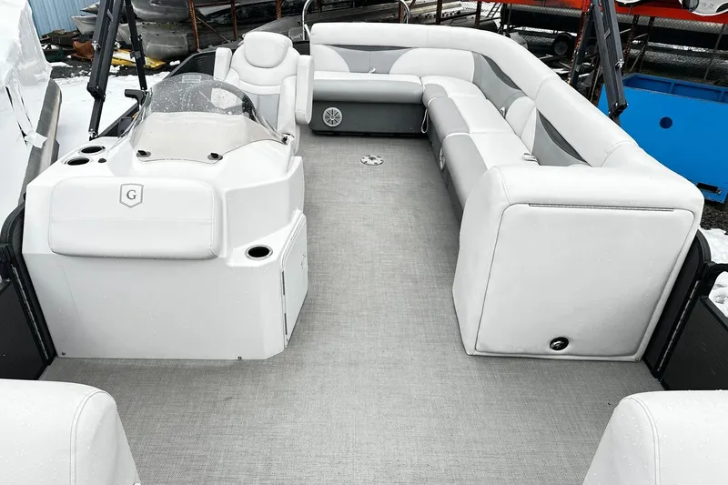 Slide: The Image of 2018 Godfrey Sweetwater 2486 C pontoon boat interior with spacious seating and helm. - 7