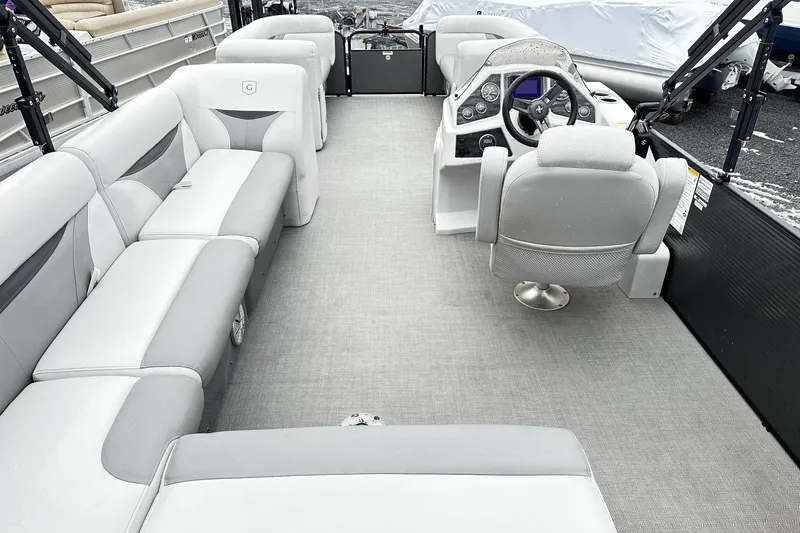 Slide: The Image of 2018 Godfrey Sweetwater 2486 C pontoon boat interior with spacious seating and modern helm. - 3