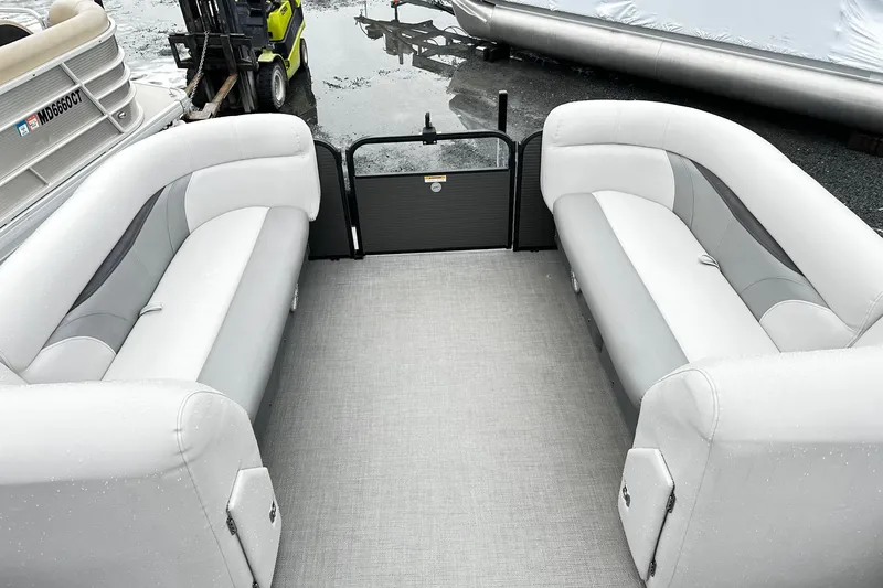 Slide: The Image of 2018 Godfrey Sweetwater 2486 C pontoon boat interior with gray seating and flooring. - 8