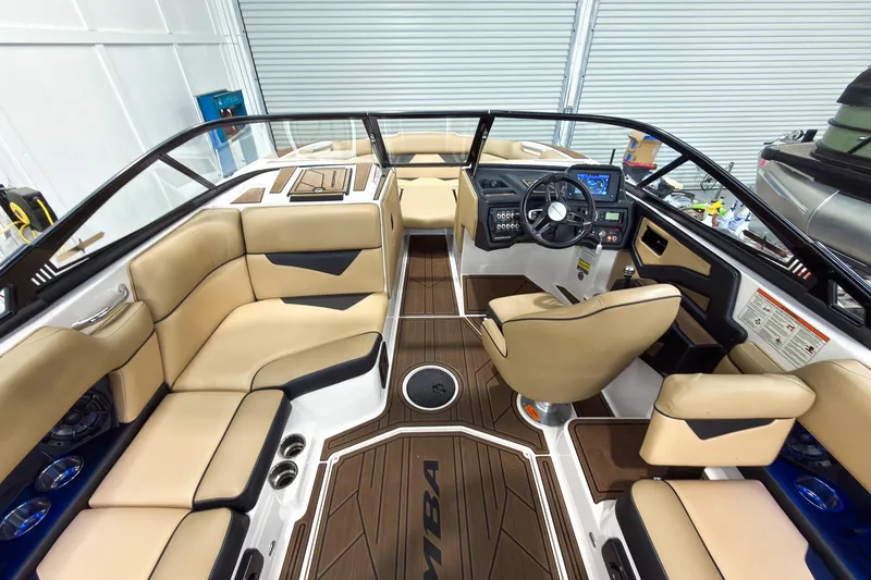 Slide: The Image of 2020 Moomba Kaiyen boat interior with beige seating and modern dashboard. - 16