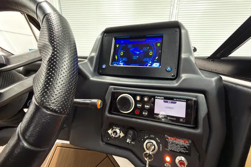 Slide: The Image of 2020 Moomba Kaiyen dashboard with touchscreen display and control panel. - 20