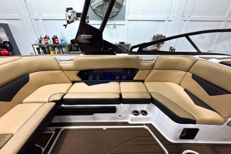 Slide: The Image of Luxurious interior of a 2020 Moomba Kaiyen boat with tan and black seating. - 25