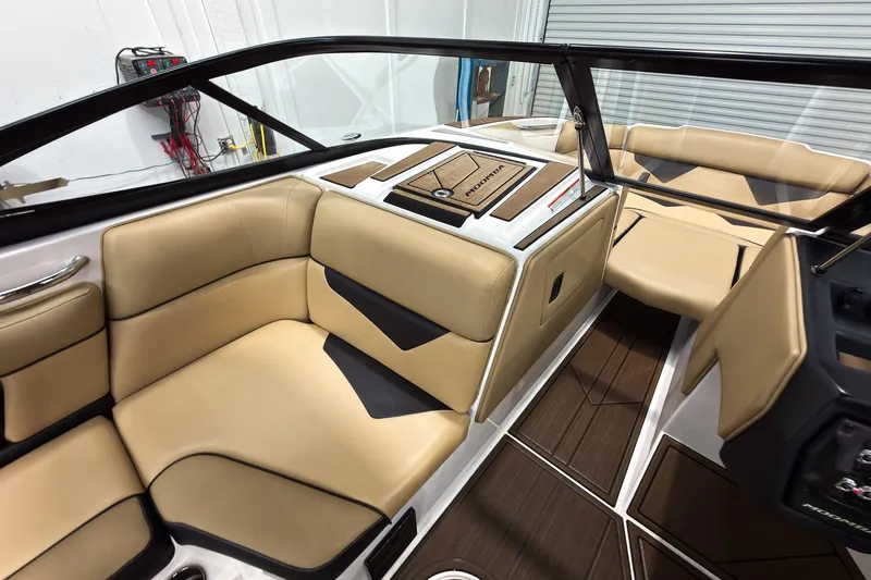 Slide: The Image of 2020 Moomba Kaiyen boat interior with tan seating and sleek design. - 29