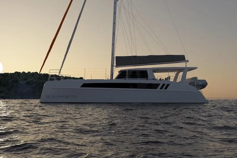 Slide: The Image of 2026 Seawind 1270 catamaran sailing at sunset, silhouetted against the horizon. - 11
