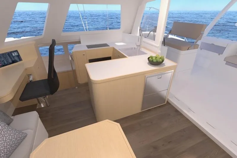 Slide: The Image of Modern interior of 2026 Seawind 1270 catamaran with ocean view, featuring sleek kitchen and seating area. - 17