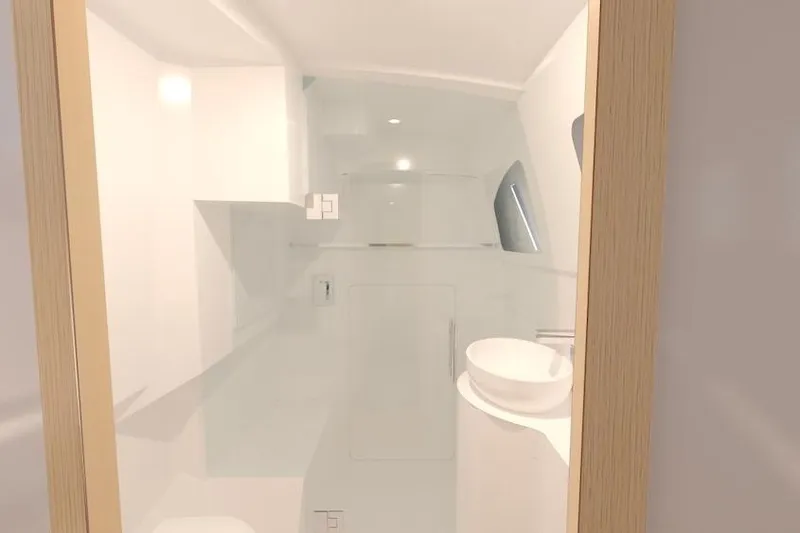 Slide: The Image of Modern bathroom interior of 2026 Seawind 1270 yacht, featuring sleek design and white fixtures. - 21