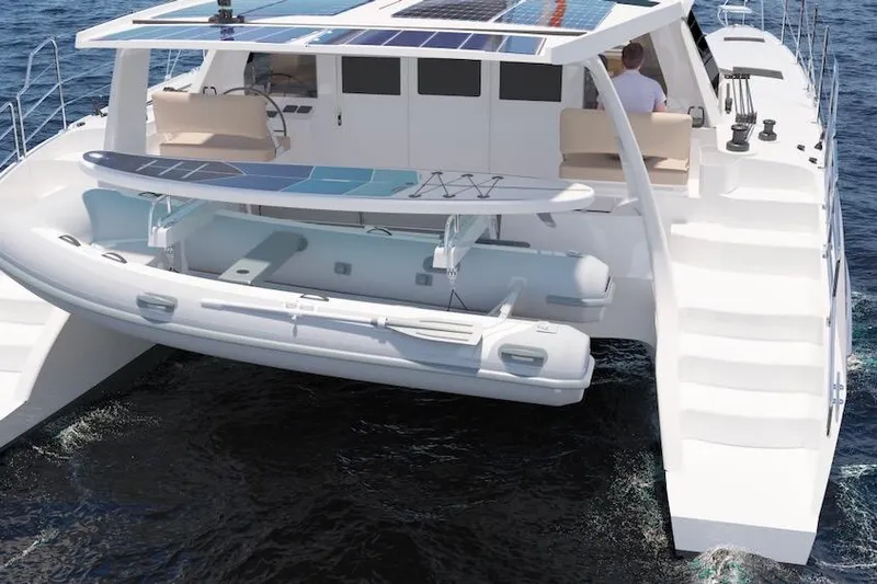 Slide: The Image of 2026 Seawind 1270 catamaran with solar panels and paddleboard, cruising on open water. - 5