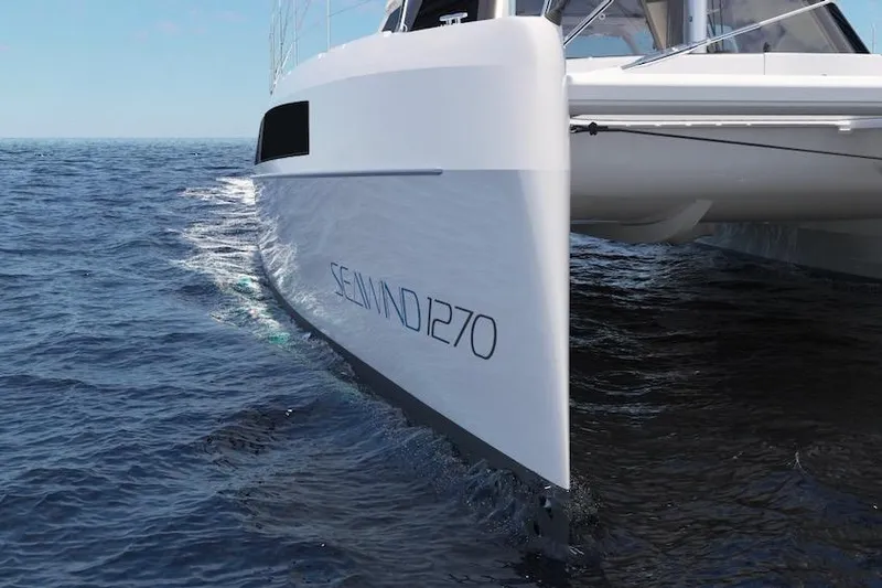 Slide: The Image of 2026 Seawind 1270 catamaran sailing on open ocean waters. - 8