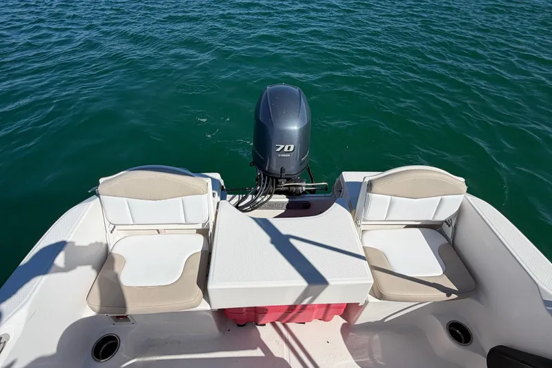 Slide: The Image of 2020 Robalo R160 Center Console boat with Yamaha 70 engine on open water. - 21