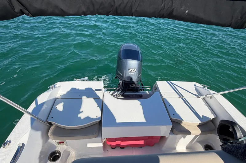 Slide: The Image of 2020 Robalo R160 Center Console boat with Yamaha 70 engine on open water. - 23