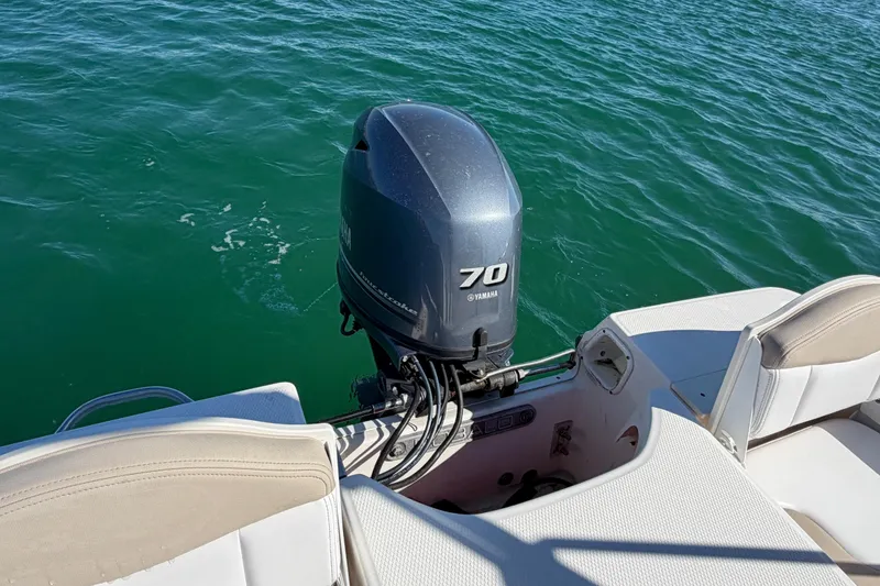 Slide: The Image of 2020 Robalo R160 Center Console with Yamaha 70 outboard motor on water. - 31