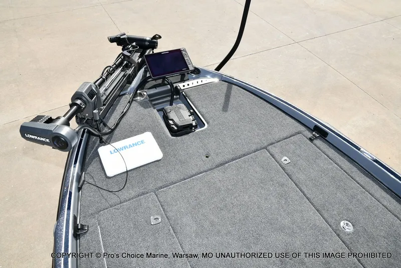 Slide: The Image of 2022 Triton 19 TRX PATRIOT with Lowrance equipment on gray deck. - 10