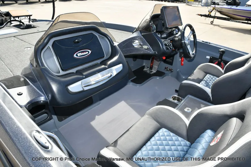 Slide: The Image of Interior of a 2022 Triton 19 TRX PATRIOT boat with modern features. - 14