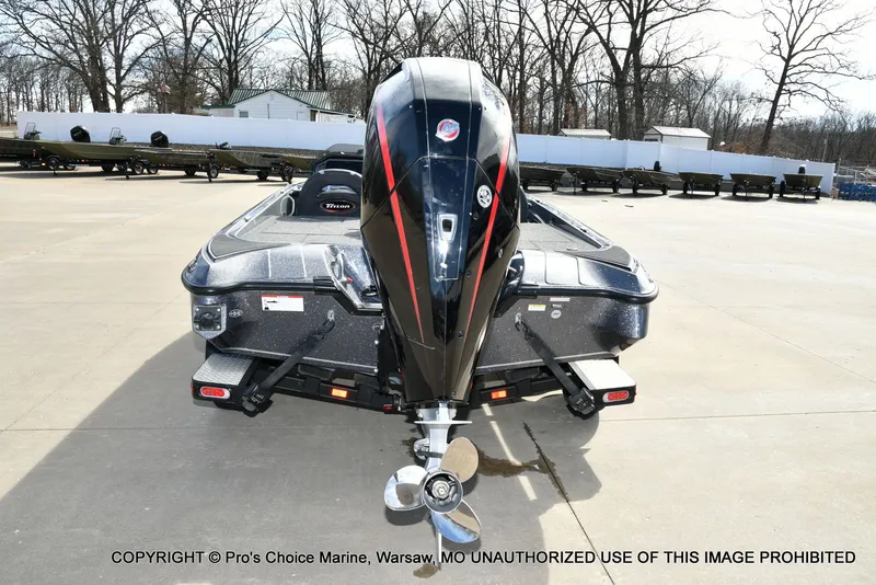 Slide: The Image of 2022 Triton 19 TRX PATRIOT boat with 225HP engine, rear view. - 26