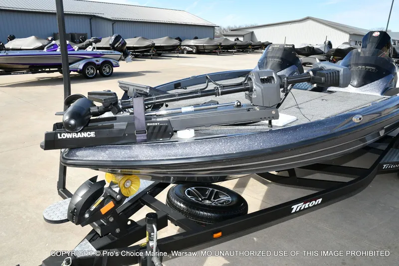 Slide: The Image of 2022 Triton 19 TRX PATRIOT with Lowrance equipment on trailer. - 29