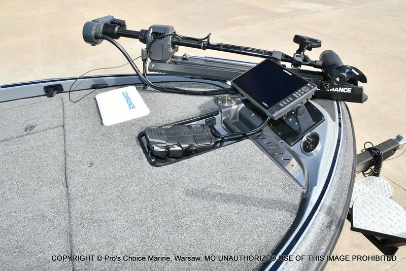 Slide: The Image of 2022 Triton 19 TRX PATRIOT with Lowrance equipment on gray deck. - 3