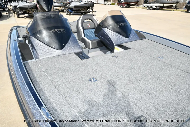Slide: The Image of 2022 Triton 19 TRX PATRIOT boat with 225HP engine on parking lot. - 37