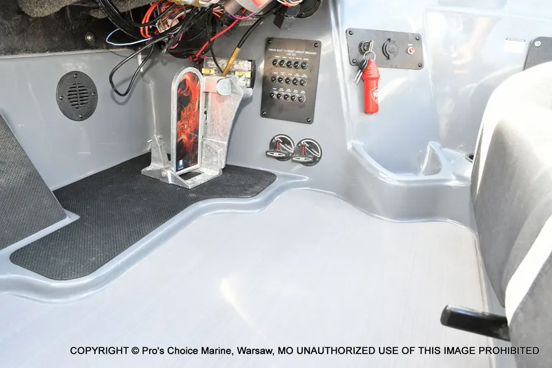 Slide: The Image of Interior of a 2022 Triton 19 TRX PATRIOT boat with controls. - 48