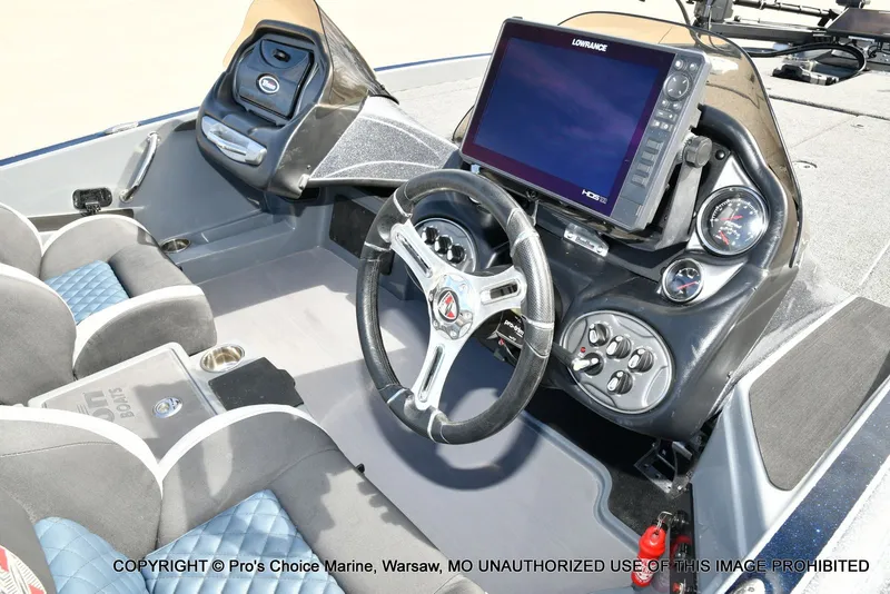 Slide: The Image of Interior view of 2022 Triton 19 TRX PATRIOT boat with control console. - 6
