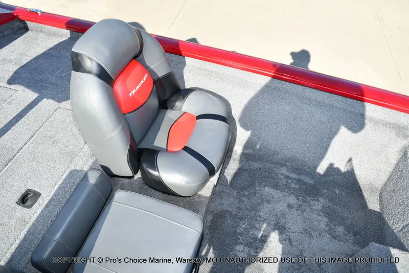 Slide: The Image of Tracker PRO TEAM 175 boat seat, gray and red design, 2025 model. - 42
