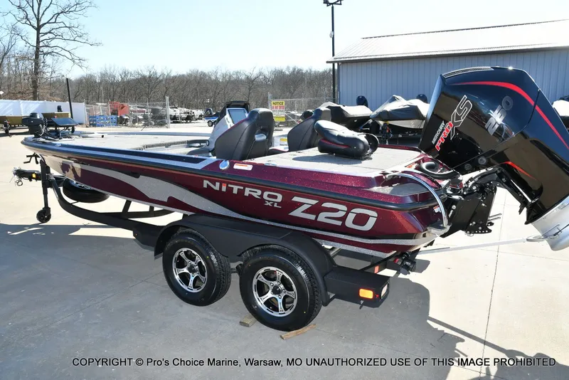 Slide: The Image of 2025 Nitro Z20 XL Pro boat on trailer outdoors. - 27