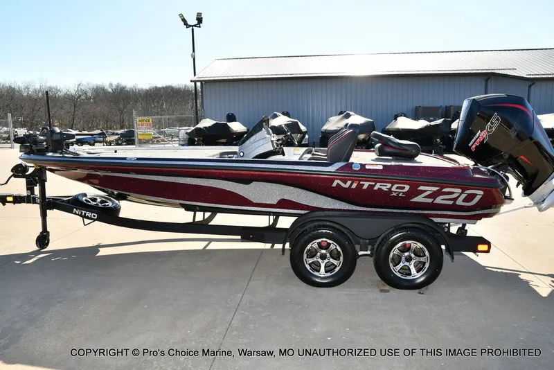 Slide: The Image of 2025 Nitro Z20 XL Pro boat on trailer outdoors. - 28