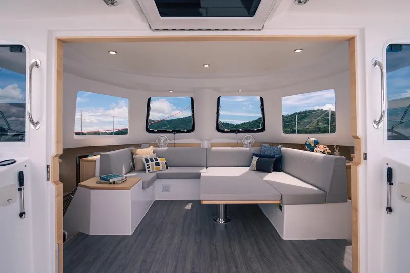 Slide: The Image of Luxurious interior of 2026 Seawind 1160XL catamaran with modern seating and panoramic windows. - 10
