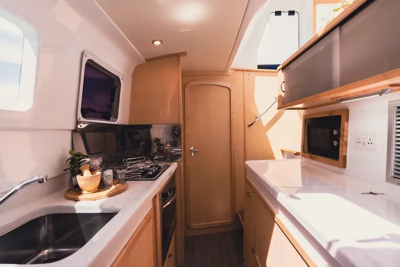 Slide: The Image of Modern kitchen interior of 2026 Seawind 1160XL catamaran with sleek design and appliances. - 12