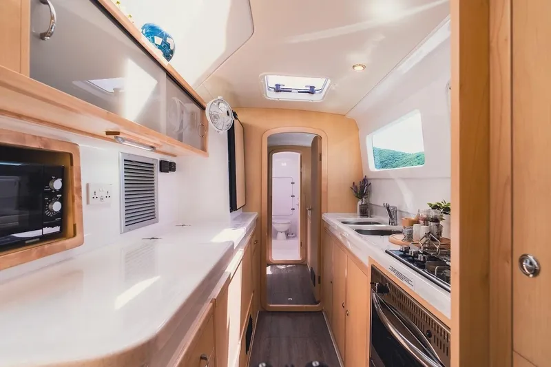 Slide: The Image of Luxurious interior of 2026 Seawind 1160XL catamaran with modern kitchen amenities. - 13