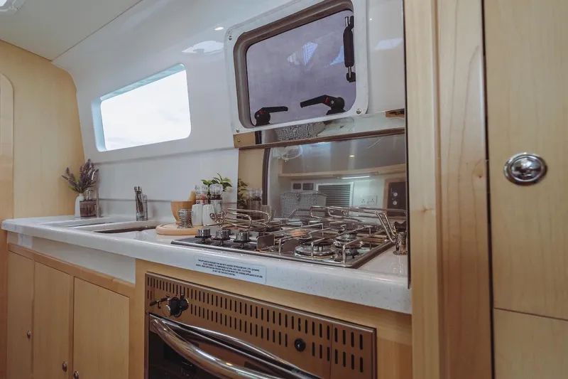 Slide: The Image of Modern kitchen interior of 2026 Seawind 1160XL yacht with stove and sink. - 14