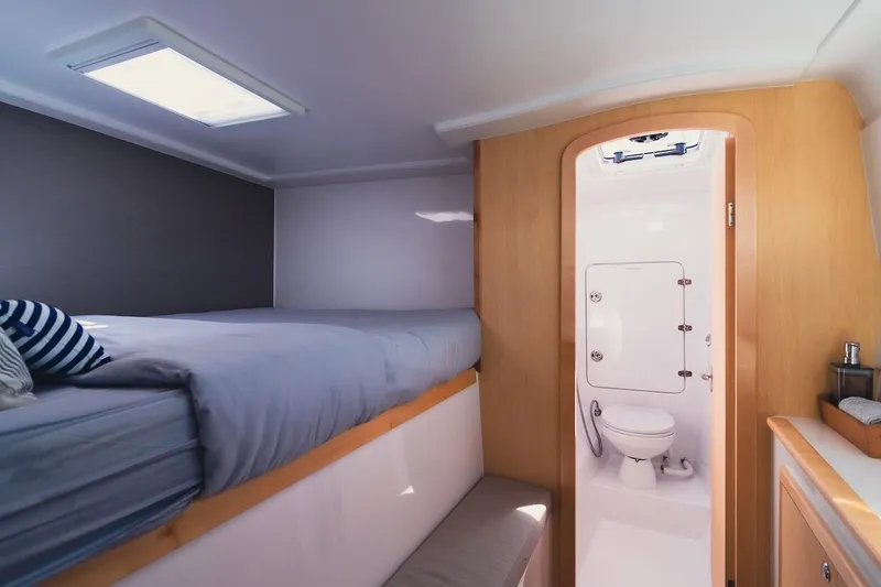 Slide: The Image of Interior of 2026 Seawind 1160XL yacht cabin with bed and bathroom. - 18