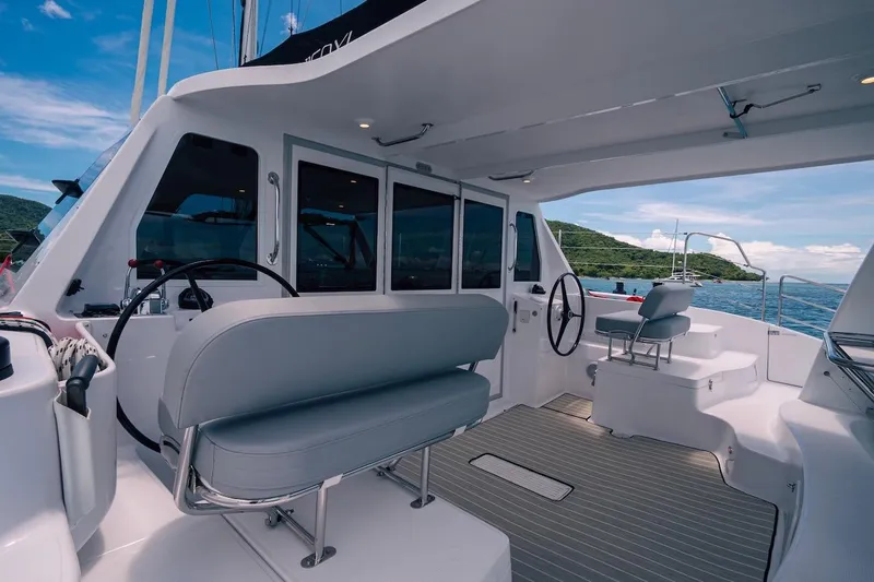 Slide: The Image of 2026 Seawind 1160XL yacht cockpit with modern seating and steering, ocean view. - 7
