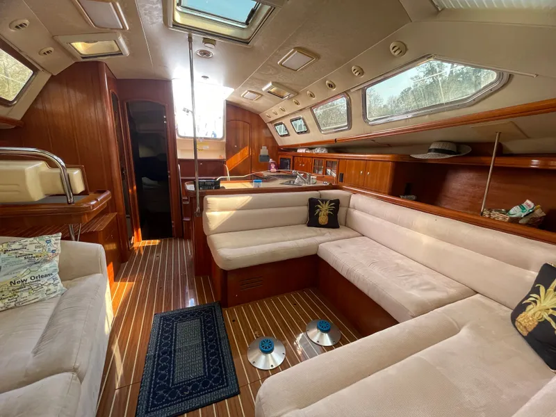 Slide: The Image of Interior of a 2007 Hunter 41 yacht with elegant wood finish. - 14