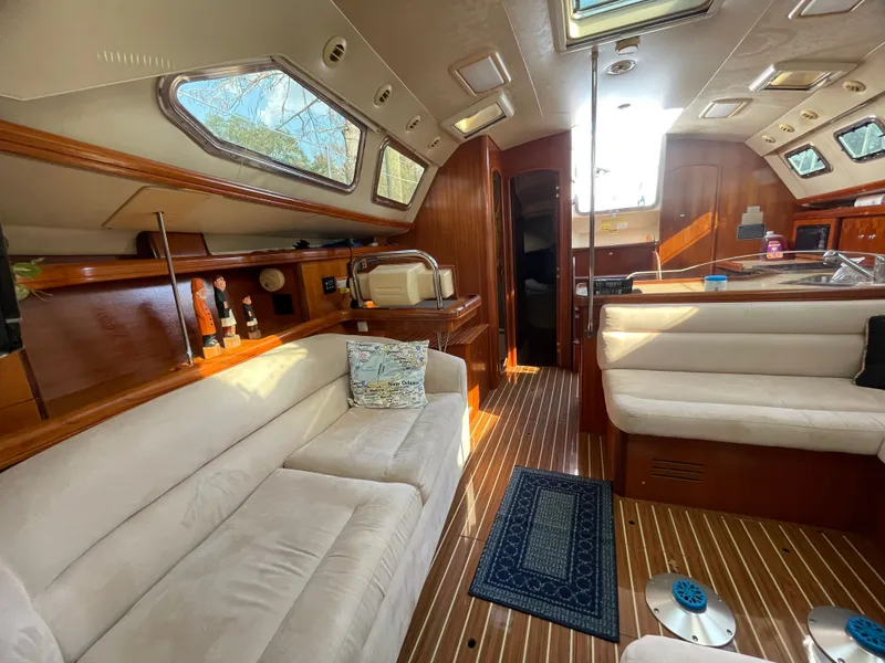 Slide: The Image of Interior of a 2007 Hunter 41 yacht with elegant furnishings. - 16