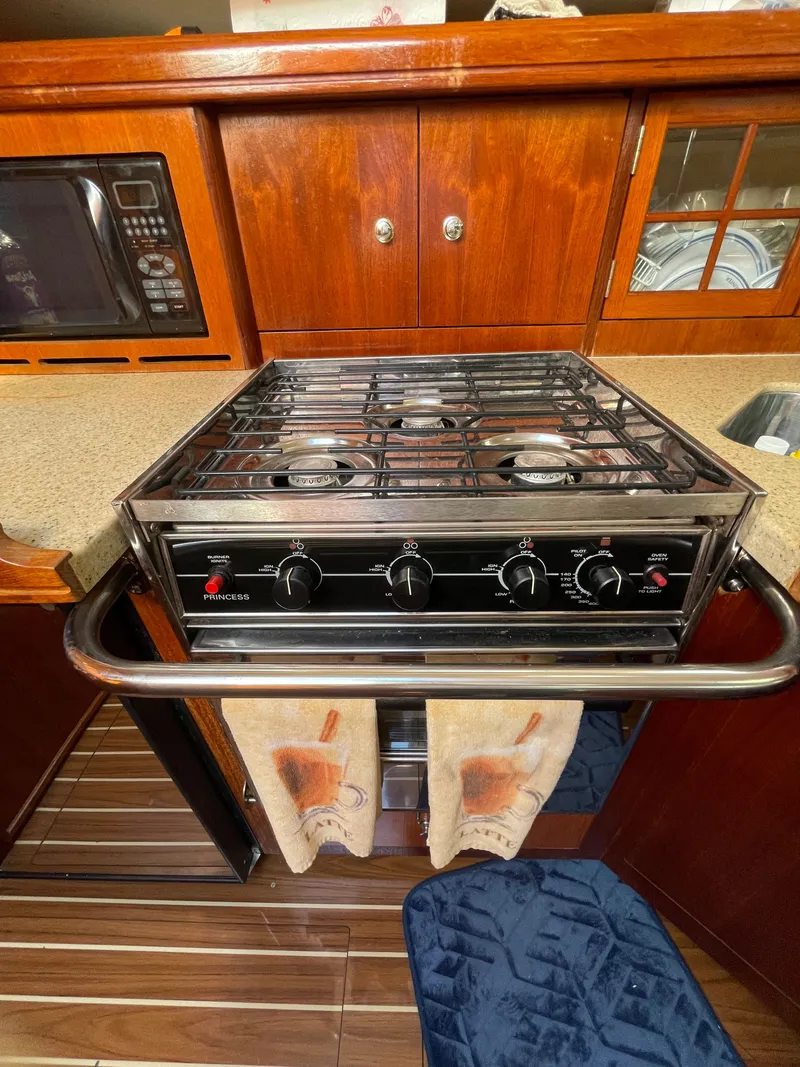 Slide: The Image of Galley of a 2007 Hunter 41 yacht featuring stove and microwave. - 22