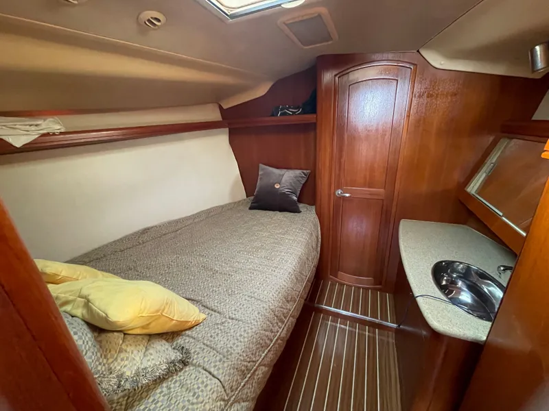 Slide: The Image of Interior of a 2007 Hunter 41 yacht with bed and sink. - 24