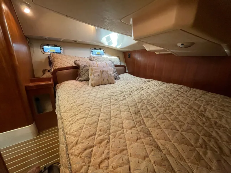 Slide: The Image of Interior of a 2007 Hunter 41 yacht featuring a cozy bedroom. - 28