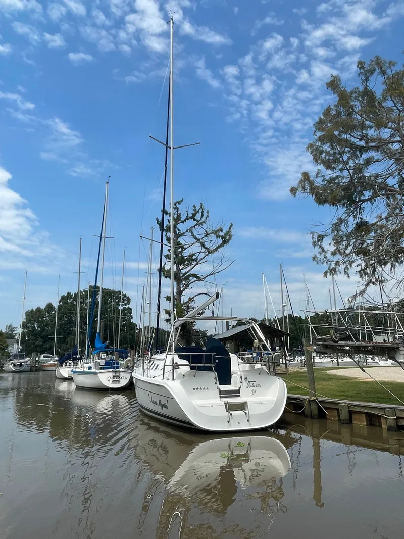 Slide: The Image of Rear view of a 2007 Hunter 41 yacht docked in harbor. - 3