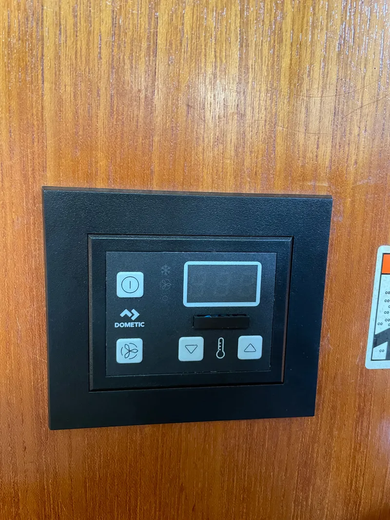 Slide: The Image of Dometic control panel on wood paneling, Hunter 41, 2007. - 31