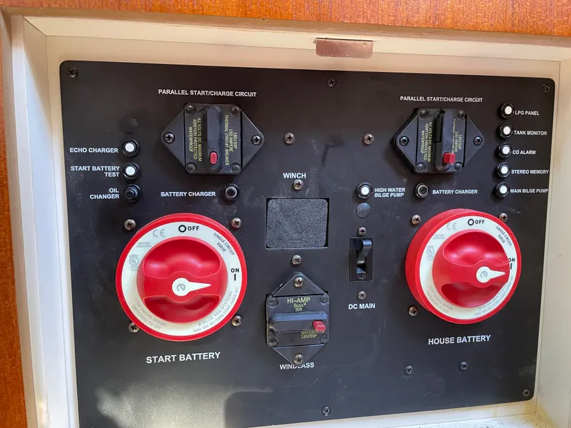 Slide: The Image of Control panel of a 2007 Hunter 41 boat with battery and pump switches. - 37