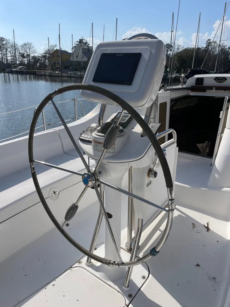 Slide: The Image of Steering wheel of a 2007 Hunter 41 yacht in harbor. - 6