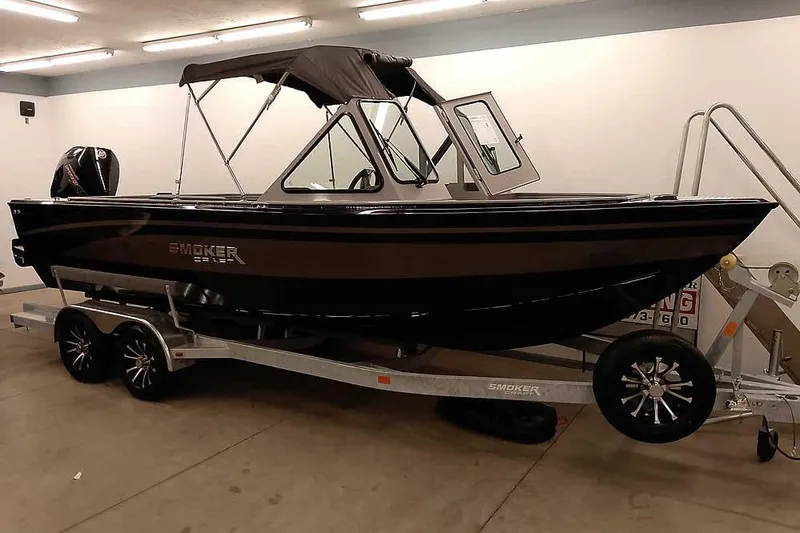 The Image of 2026 Smoker Craft Phantom 20 X2 Offshore boat on trailer in garage. - 0