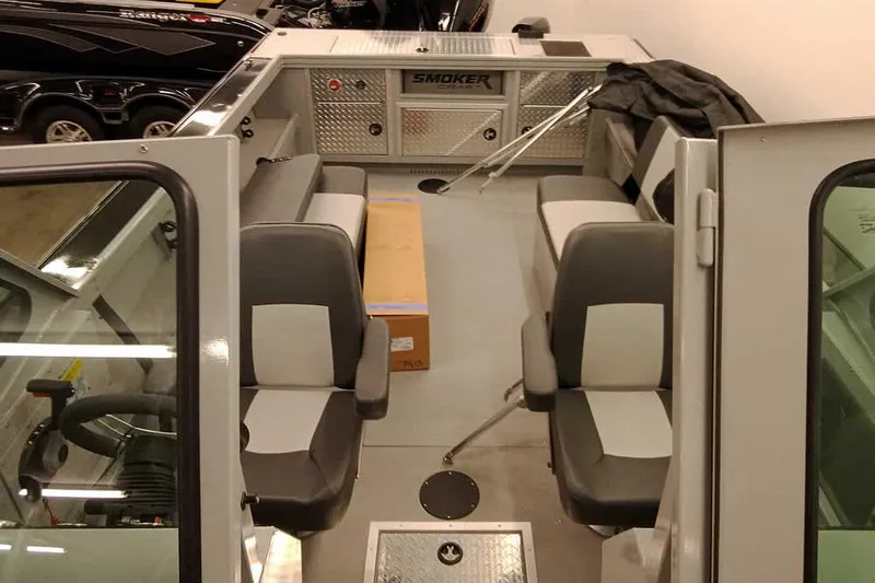 Slide: The Image of 2026 Smoker Craft Phantom 20 X2 Offshore boat interior with seating and storage. - 13