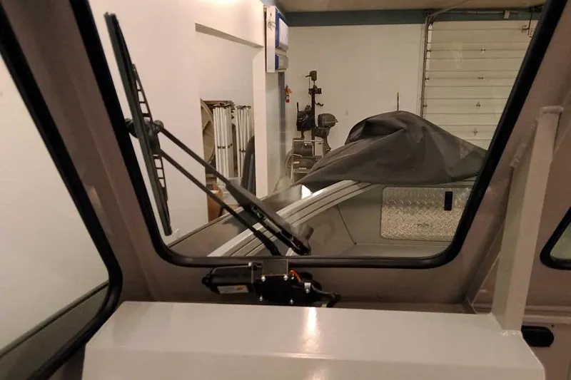 Slide: The Image of Interior view of 2026 Smoker Craft Phantom 20 X2 Offshore boat in a garage. - 14