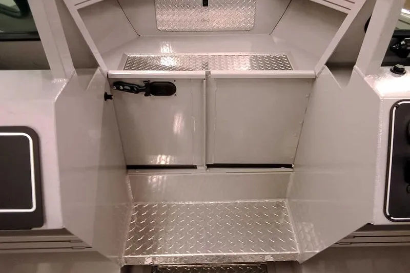 Slide: The Image of 2026 Smoker Craft Phantom 20 X2 Offshore boat interior with diamond plate flooring. - 15