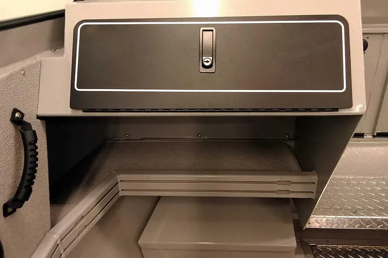 Slide: The Image of 2026 Smoker Craft Phantom 20 X2 Offshore storage compartment with secure lock. - 16