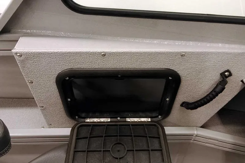 Slide: The Image of Interior of 2026 Smoker Craft Phantom 20 X2 Offshore boat, featuring storage compartment and handle. - 18