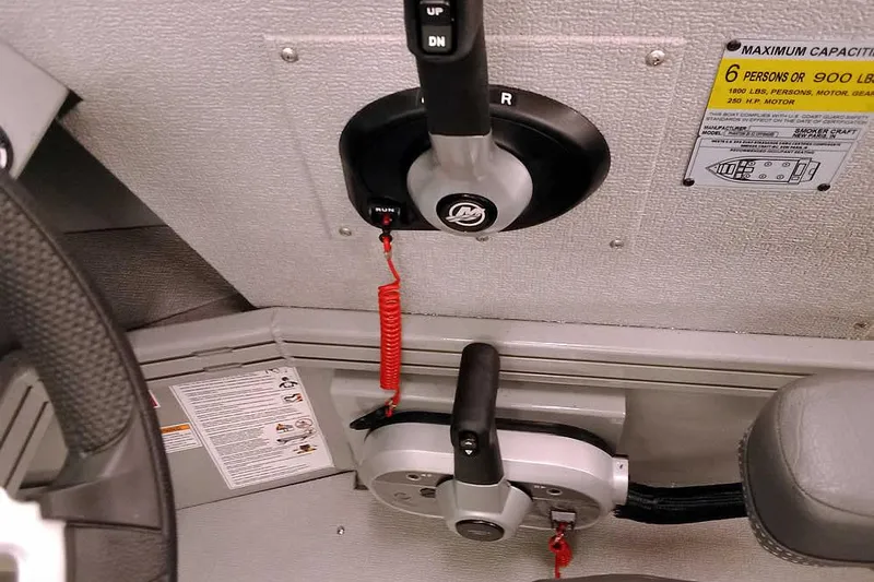 Slide: The Image of 2026 Smoker Craft Phantom 20 X2 Offshore boat controls and capacity label. - 21