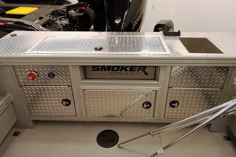 Slide: The Image of 2026 Smoker Craft Phantom 20 X2 Offshore boat interior with storage compartments and sink. - 26
