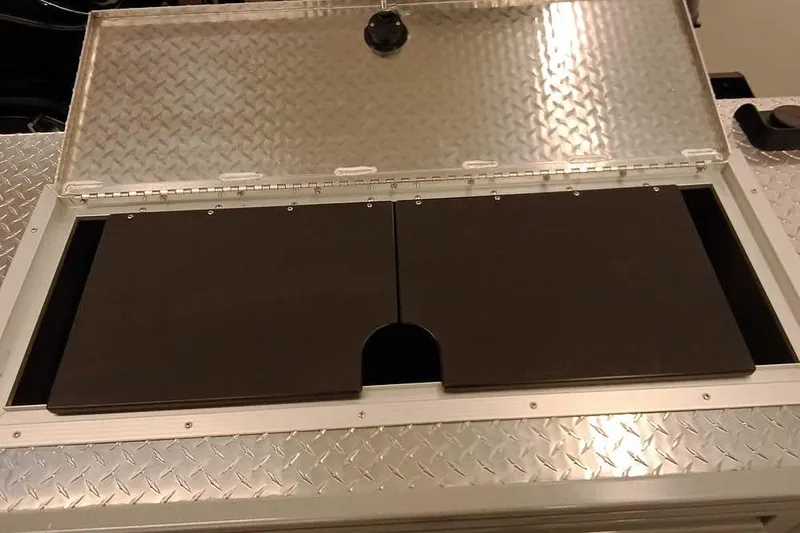 Slide: The Image of Open storage compartment on 2026 Smoker Craft Phantom 20 X2 Offshore boat. - 28